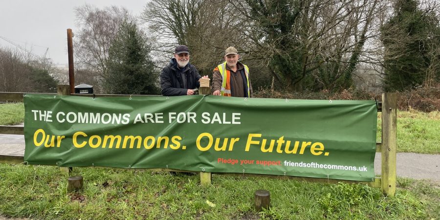 Two campaigners with campaign banner on the Commons.