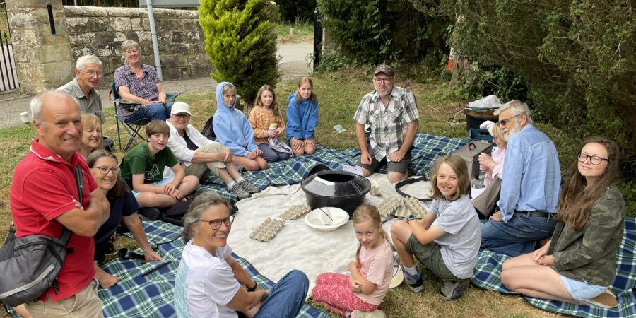 people sat around a moth trap